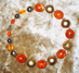 ORANGE CHUNKY -  Antique orange Bakelite beads. 24k center bead. 19" Gold-plated pewter toggle clasp.$88 